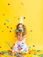 portrait-little-beautiful-girl-celebrating-her-birthday-colorful-confetti_132375-1462